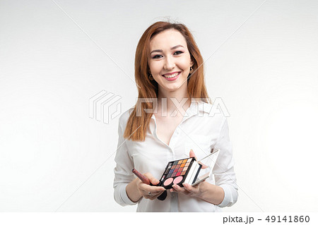 Makeup artist, beauty and cosmetics concept - Korean female make-up artist with makeup brushes and 49141860