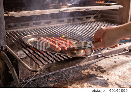 food, delicious and meat dishes concept - Horse sausages prepared on barbeque food, delicious and meat dishes concept - Horse sausages prepared on barbeque 49142896
