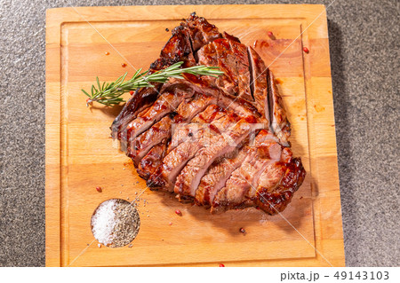 food, delicious, horse meat and craft concept - serving of grilled steak food, delicious, horse meat and craft concept - serving of grilled steak 49143103