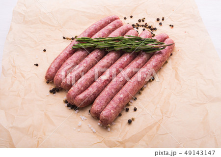 food, delicious and serving concept - sausages on board food, delicious and serving concept - sausages on board 49143147