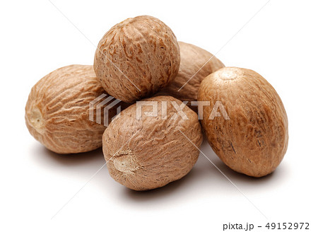 Group of whole nutmeg isolated on white Group of whole nutmeg isolated on white 49152972