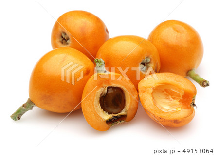 Half and whole ripe loquat fruits isolated on Half and whole ripe loquat fruits isolated on 49153064
