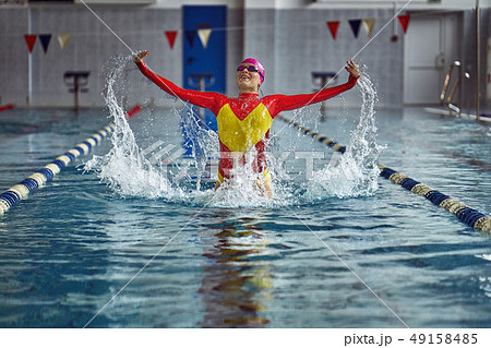 Female athlete in a red-yellow swimsuit Female athlete in a red-yellow swimsuit 49158485