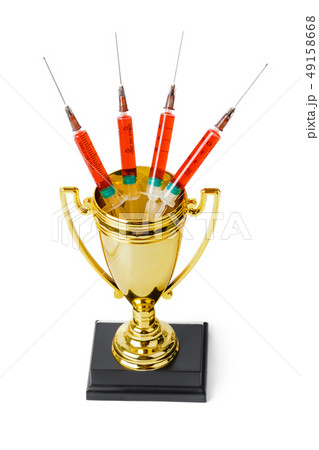 Golden trophy cup and syringes 49158668