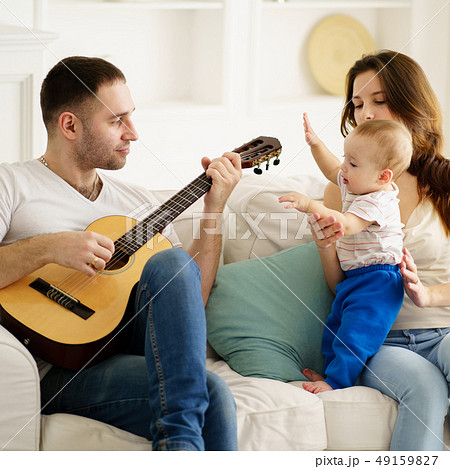 Family in living room, leisure activities Family in living room, leisure activities 49159827