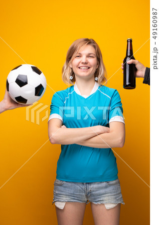 Photo of sports blonde with arms crossed is choosing between ball and bottle of alcohol 49160987