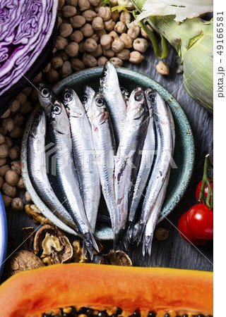 raw fish, fruits, vegetables and nuts raw fish, fruits, vegetables and nuts 49166581