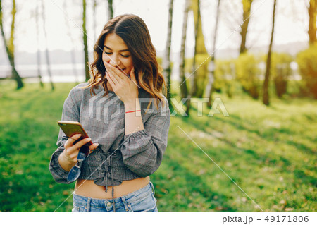 stylish girl in a park stylish girl in a park 49171806