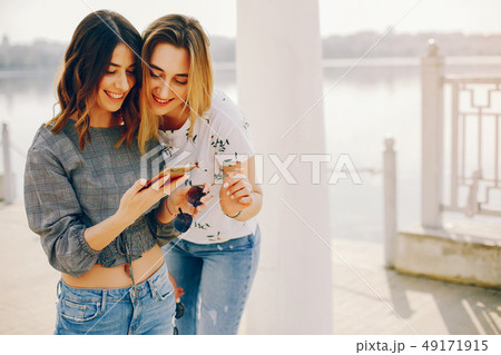two girls in a summer park two girls in a summer park 49171915