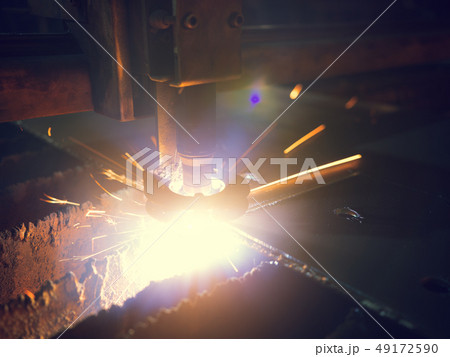 Close-up Laser Cutting Machine Cuts A Sheet Of Metal Close-up Laser Cutting Machine Cuts A Sheet Of Metal 49172590