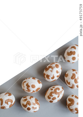 White Easter eggs with a gold pattern 49173759