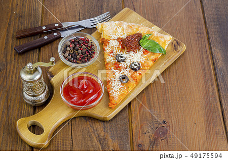 Slice of pizza with dried tomatoes, olives, Slice of pizza with dried tomatoes, olives, 49175594