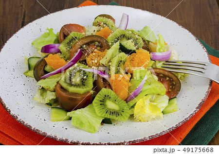 Fruit and vegetable salad with tangerines. Fruit and vegetable salad with tangerines. 49175668