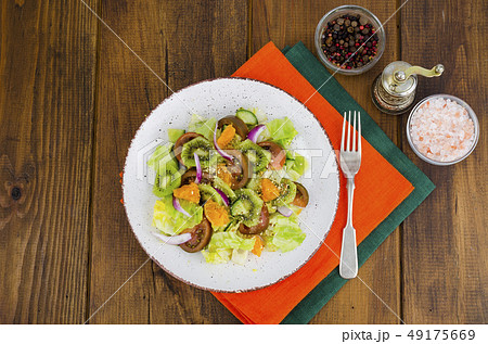 Fruit and vegetable salad with tangerines. 49175669