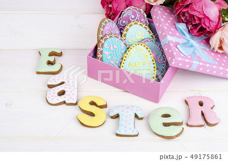Colorful easter egg in gift box, cookies biscuits Colorful easter egg in gift box, cookies biscuits 49175861