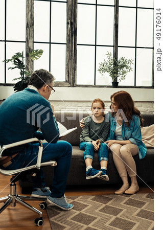 Pleasant worried woman looking at her daughter 49176014