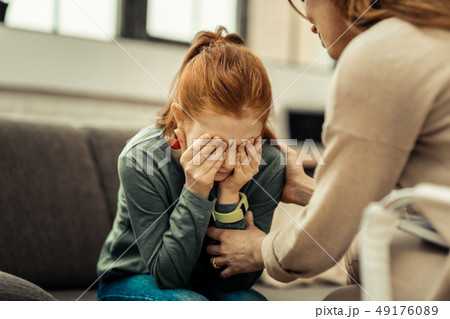 Sad cheerless girl thinking about her problems 49176089