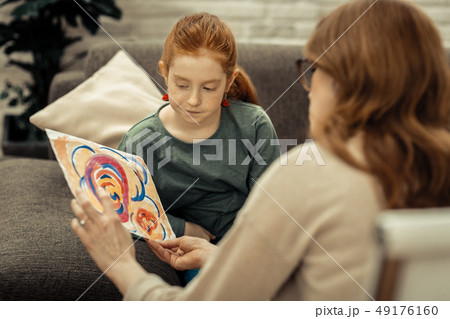 Nice gloomy girl looking at the painting Nice gloomy girl looking at the painting 49176160