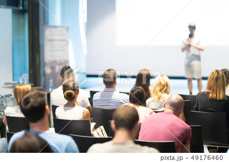 Business speaker giving a talk at business conference event. Business speaker giving a talk at business conference event. 49176460