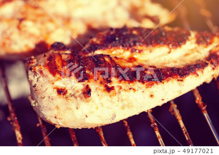Grilled chicken breast on barbeque 49177021