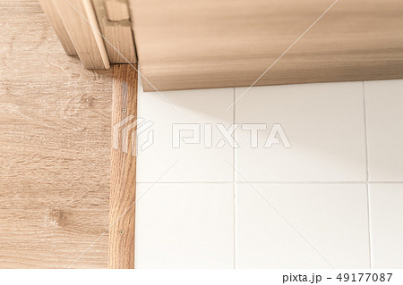 Room indoors. Hinge, jamb and plinth near doorway Room indoors. Hinge, jamb and plinth near doorway 49177087