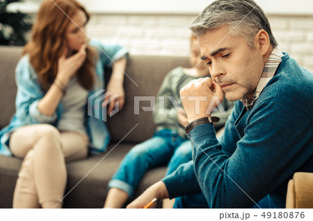Serious thoughtful man thinking about his patients 49180876
