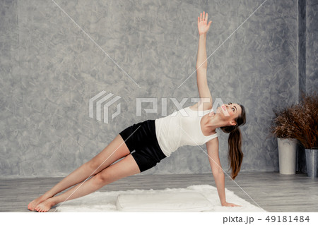 Young woman yoga on carpet at home living room. Young woman yoga on carpet at home living room. 49181484