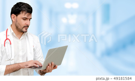 Doctor using laptop computer at the hospital. 49181584