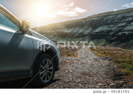 SUV vehicle car running on gravel road. 49181591