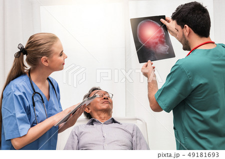 Doctor team work with x ray film image of patient. 49181693