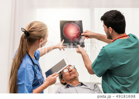 Doctor team work with x ray film image of patient. 49181698