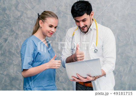 Doctor and nurse working with laptop computer. 49181715