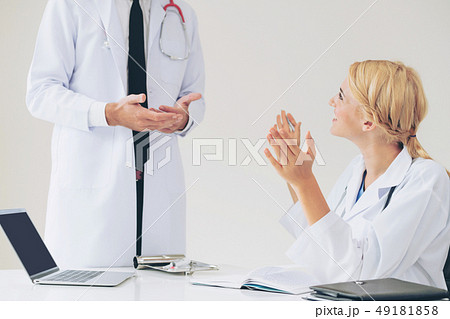 Female doctor at hospital talking to her partner. 49181858