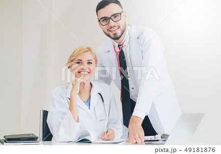 Happy doctor portrait with work partner. 49181876
