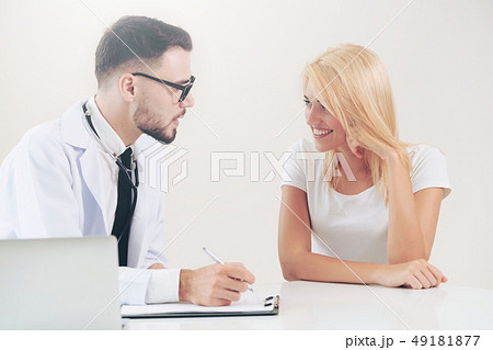 Male Doctor and Female Patient in Hospital Office 49181877