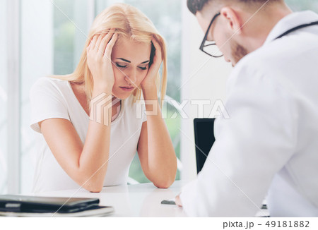 Male Doctor and Female Patient in Hospital Office 49181882