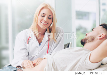 Woman Doctor and Male Patient in Hospital Office 49181928
