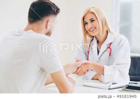 Doctor shake hand with patient in the hospital. Doctor shake hand with patient in the hospital. 49181940
