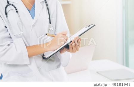 Young female doctor working in hospital office. Young female doctor working in hospital office. 49181945