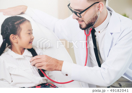 Doctor examining little happy kid in hospital. 49182041