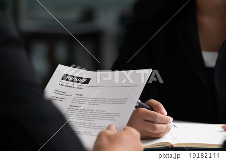 Human resources department manager reads CV resume 49182144