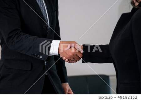 Business people handshake agreement in office. 49182152