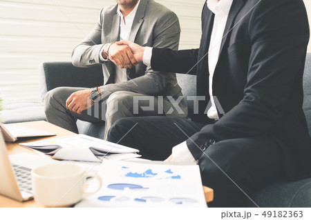 Businessmen handshake business deal in office. Businessmen handshake business deal in office. 49182363