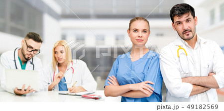 Doctor working in hospital with other doctors. Doctor working in hospital with other doctors. 49182569