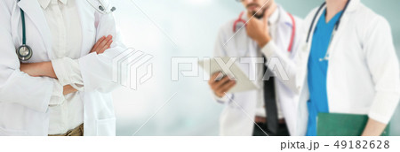 Doctor working in hospital with other doctors. 49182628