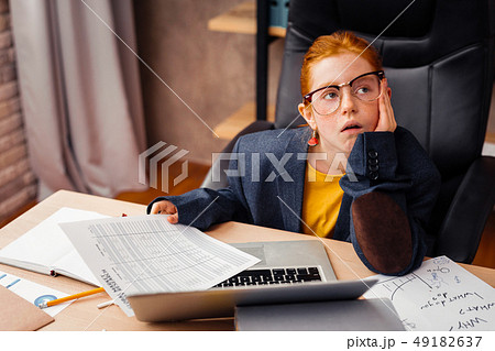 Nice thoughtful girl wearing a big jacket 49182637