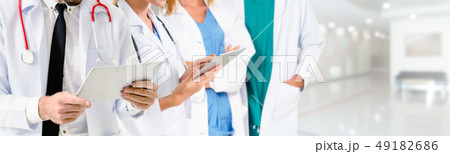 Doctor working in hospital with other doctors. Doctor working in hospital with other doctors. 49182686