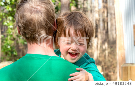 Happy toddler boy being held 49183248