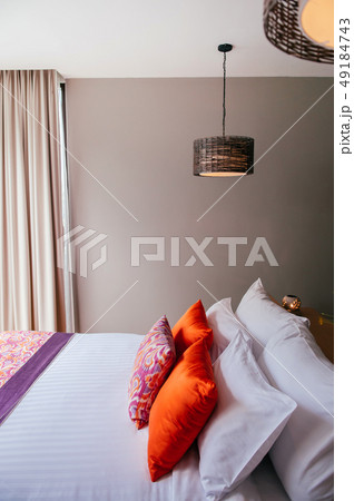 Asian tropical hotel room with bed and colourful Asian tropical hotel room with bed and colourful 49184743