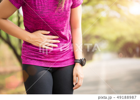 Sport girl have stomach pain after jogging Sport girl have stomach pain after jogging 49188987